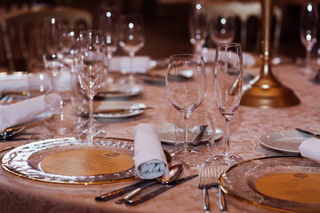 Wedding. Details. Decorated wedding banquet hall in classic style. Restaurant interior for banquet, wedding decor. Beautifully served table in a restaurant