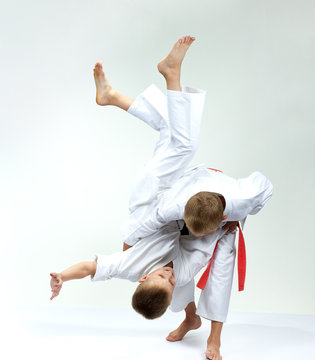 Sportsmens in performing throws judogi