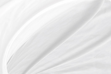 Obraz na płótnie Canvas soft fabric abstract white smooth curve decorative background. textile modern style