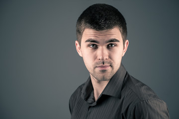 Fototapeta premium The portrait intrigued a young handsome brunet man