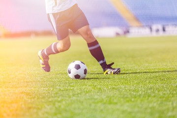 Running soccer player on grass © BillionPhotos.com