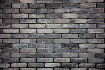 Texture of wet gray brick wall