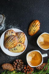 Madeleine cookies, sweet dessert and coffee on the table (delicious pastries, sweets) menu concept. food background. top view. copy space