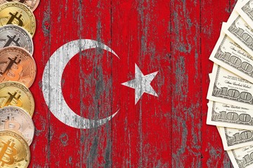 Turkey savings concept. Bitcoins and dollar banknotes on the side of national flag with wooden background. Trading currencies.