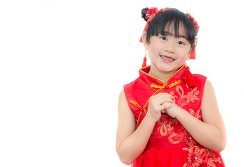 A picture of an Asian girl wearing a red Chinese dress in a white background. Concept Chinese new year for the love day and is a tradition in China every year.