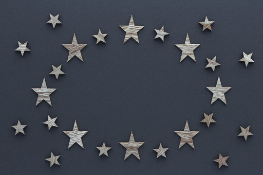 Christmas composition. Wood stars on blue background top view background with copy space for your text. Flat lay. © siggi1956