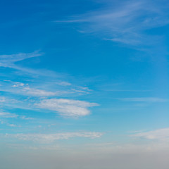 Fantastic clouds against blue sky, square