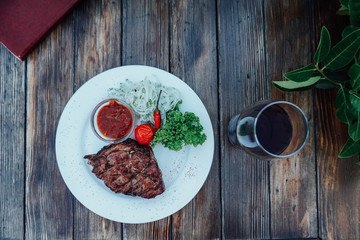 plate of fried meat steak with sauce and spices