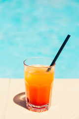 orange cocktail at the beach