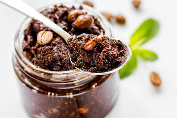 Spa concept with natural coffee scrub on wooden table background