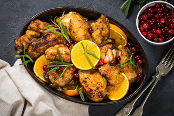 Baked chicken with orange, cranberry and rosemary.