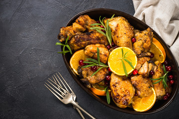 Baked chicken with orange, cranberry and rosemary.