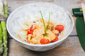 Traditional seafood noodles decorated with pepper and asparagus.
