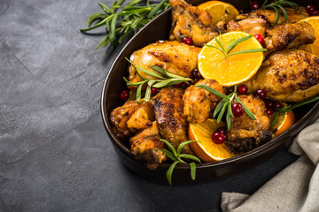 Baked chicken with orange, cranberry and rosemary.