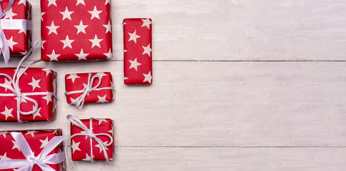 Fototapeta premium Christmas presents on a wooden table with copy space