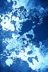 Wall with decorative plaster resembling picture of the sea. Abstract background.