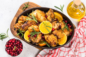 Baked chicken with orange, cranberry and rosemary.