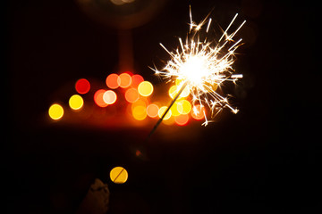 Bengal fire and sparks macro photo festive bokeh background Christmas and New Year