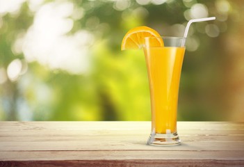 Orange juice and slices of orange fruit in glass