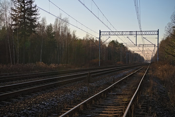 Fototapeta na wymiar Empty train tracks at sunset