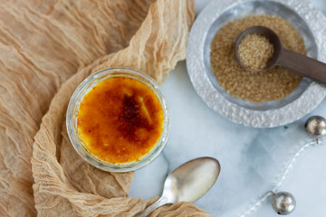 Creme brulee with raw sugar and spoon