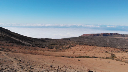 Flying over the desert landscape at the foot of the volcano. Martian or lunar landscape. Teide National Park, Tenerife, Canary Islands, Spain