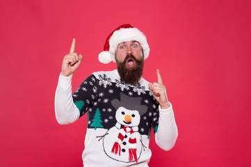 Fototapeta na wymiar Best time. excited hipster funny sweater with snowman. winter holiday celebration. feeling freedom and success. new year happiness. merry christmas to you. having fun. happy bearded man red santa hat