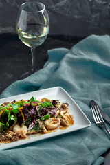 Salad of squid, mushrooms, and vegetables. The view from the top. Copy-space.