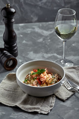 Rice noodles with shrimps and seafood, spicy asian style noodles in bowl.