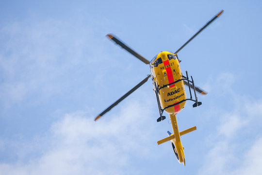 FELDKIRCHEN / GERMANY - JUNE 09, 2018: Eurocopter EC-135 from ADAC Luftrettung flies over landing side. Notarzt means emergency doctor.