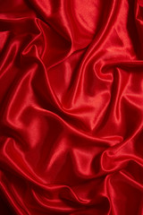 Luxury red satin smooth fabric background for celebration, ceremony, event invitation card or advertising poster