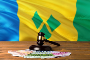 Saint Vincent And The Grenadines bribing concept. Law theme, mallet of the judge on wooden desk...
