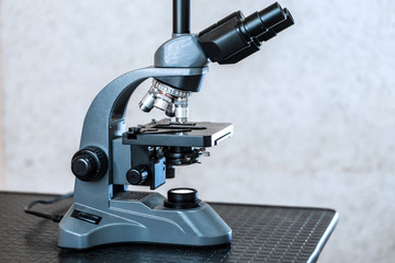 Fototapeta na wymiar a modern portable microscope in the laboratory