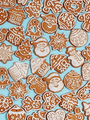 Handmade Christmas gingerbread on a blue background. New Year's concept. View from above