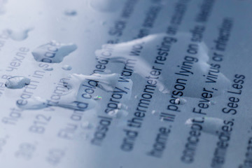 macro view of water bubbles on the pixel screen of the gadget surface with text, technology colnept