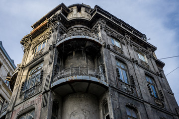 Fototapeta na wymiar Old building with grey exterior