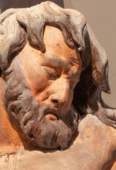 BANSKA STIAVNICA, SLOVAKIA - FEBRUARY 19, 2015: The face detail of carved statue of Impenitent thief as the part of baroque Calvary from years 1744 - 1751.