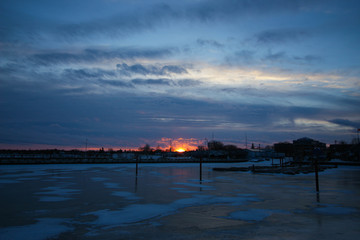 Fototapeta na wymiar Winter Sunset Over Frozen Lake