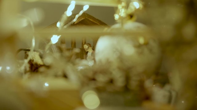 Christmas tree and manger - Blur and closup on Joseph figurine models