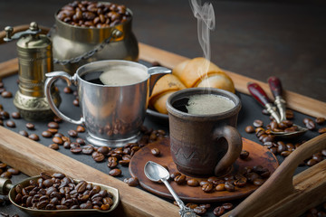 Coffee in a cup and saucer on an old background.
