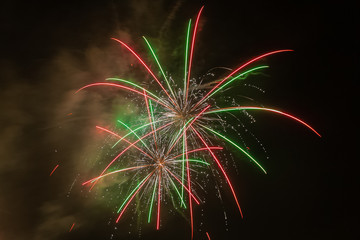 Beautiful and brilliant fireworks with italian flag colors lighting up the sky, Vittorio Veneto, Italy