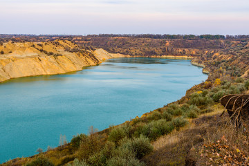 Fototapeta premium Lake with sandy bank in the abandoned coal quarry