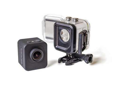 Compact action camera with protective box on white background