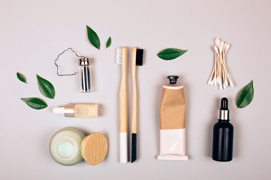 Zero waste self-care products. Bamboo toothbrush, toothpaste, tooth powder and flax. Flat lay style.