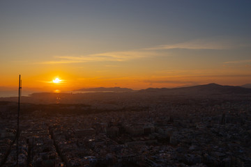 Sunset in Athens on a cloudy sky with a city view from Lycabettus hill