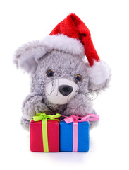 Toy mouse in the hat Santa with Christmas gifts.