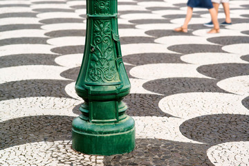 mosaic tiles pavement pattern typical  on streets and squares in Funchal, Madeira
