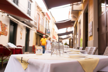 touristc restaurants and coffee shops in old city center , Funchal, Madeira Island , focus in foreground