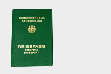 old green German passport isolated on white background with copy space