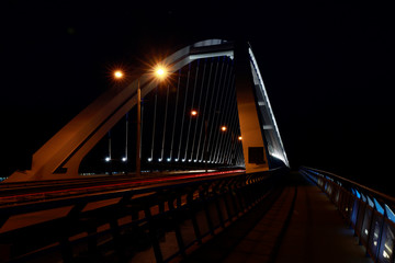 Light trails on the bridge after sunset in Bratislava. Apollo bridge Bratislava at night. 